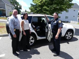 Chief DiMella, Detective Forni, and Officer Misci Install a Car Seat