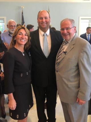 The Town Manager with Lt. Governor Karyn Polito (left) and House Speaker Robert DeLeo (right) at a Green Community ceremony.